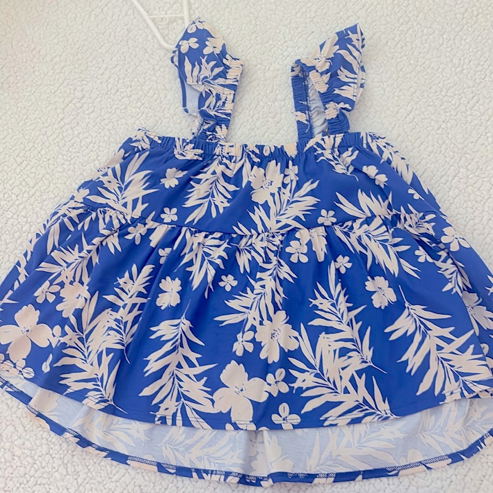 gently used blue beach pattern shirt